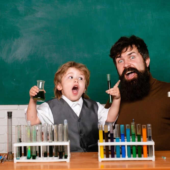 Elementary,School,Teacher,And,Student,In,Classroom.,Lesson,Plans,-